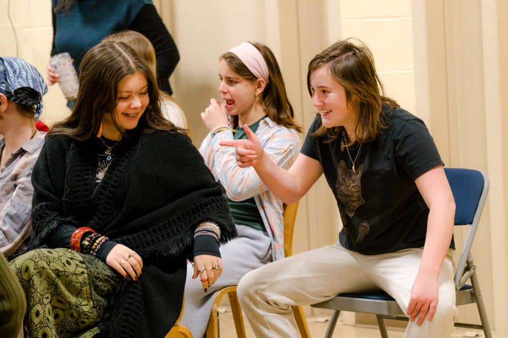 middle school students laughing together