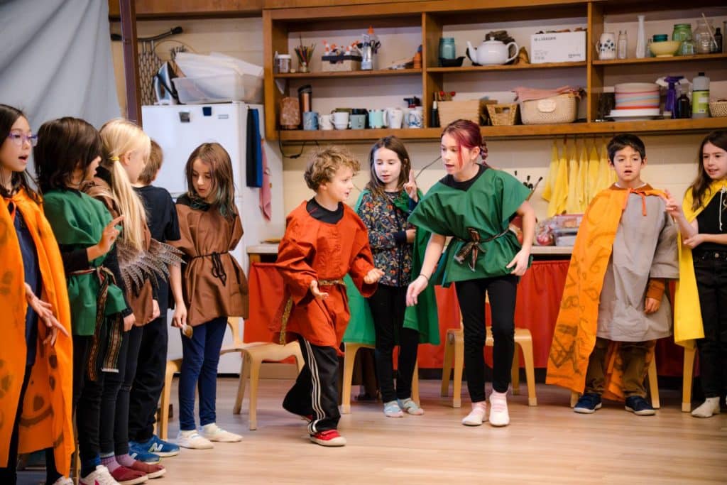 group of lower grades children in play costumes