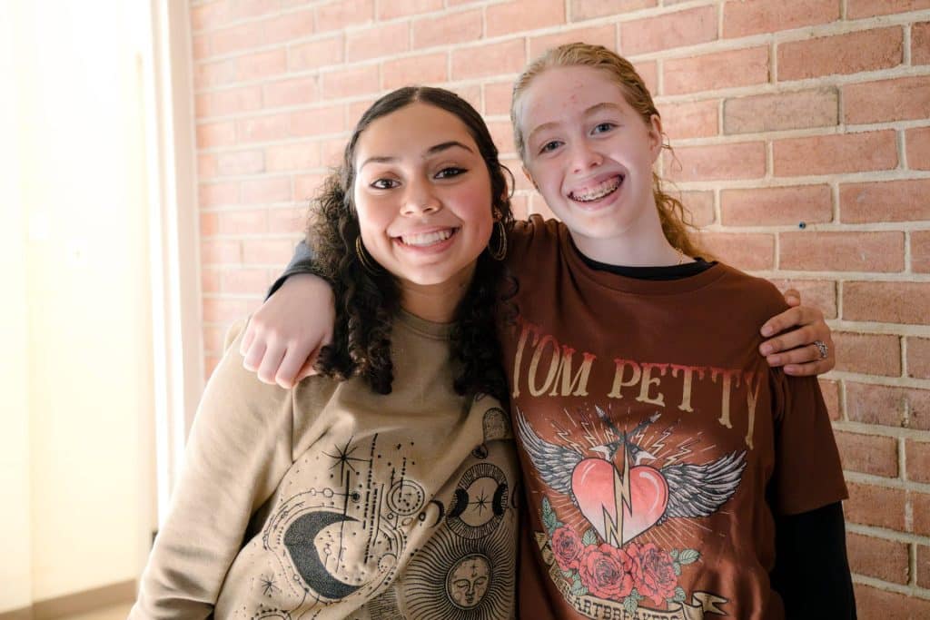 middle school female students smiling