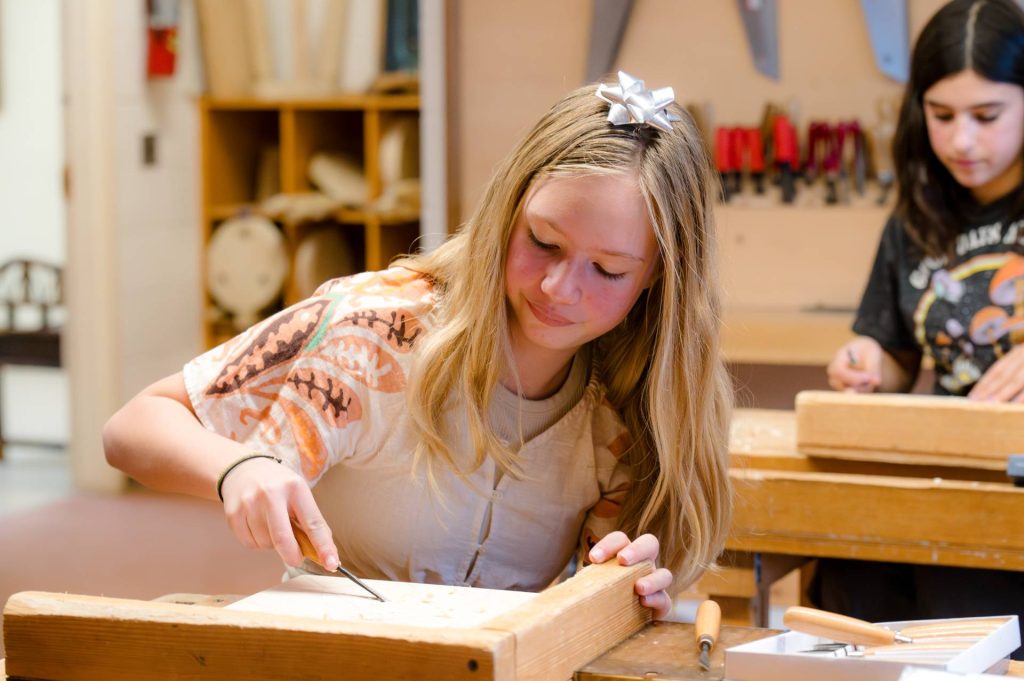 girls doing woodworking