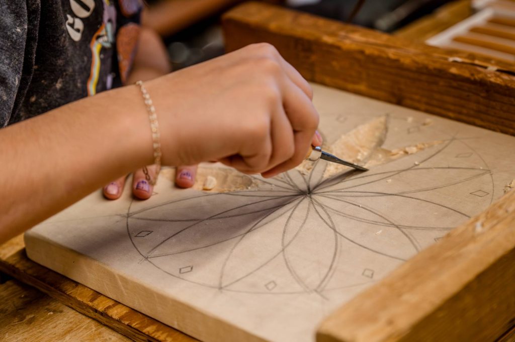 girl doing geometrical woodworking
