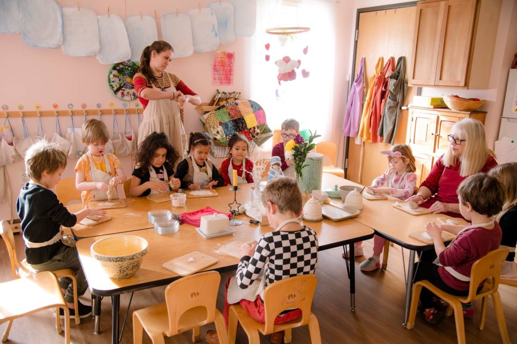 group of early childhood students sitting at a table