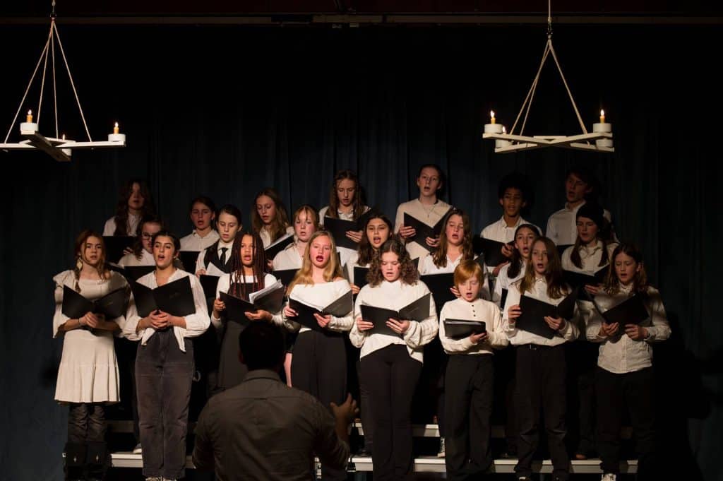 choir of river valley waldorf students performing at candlelight concert