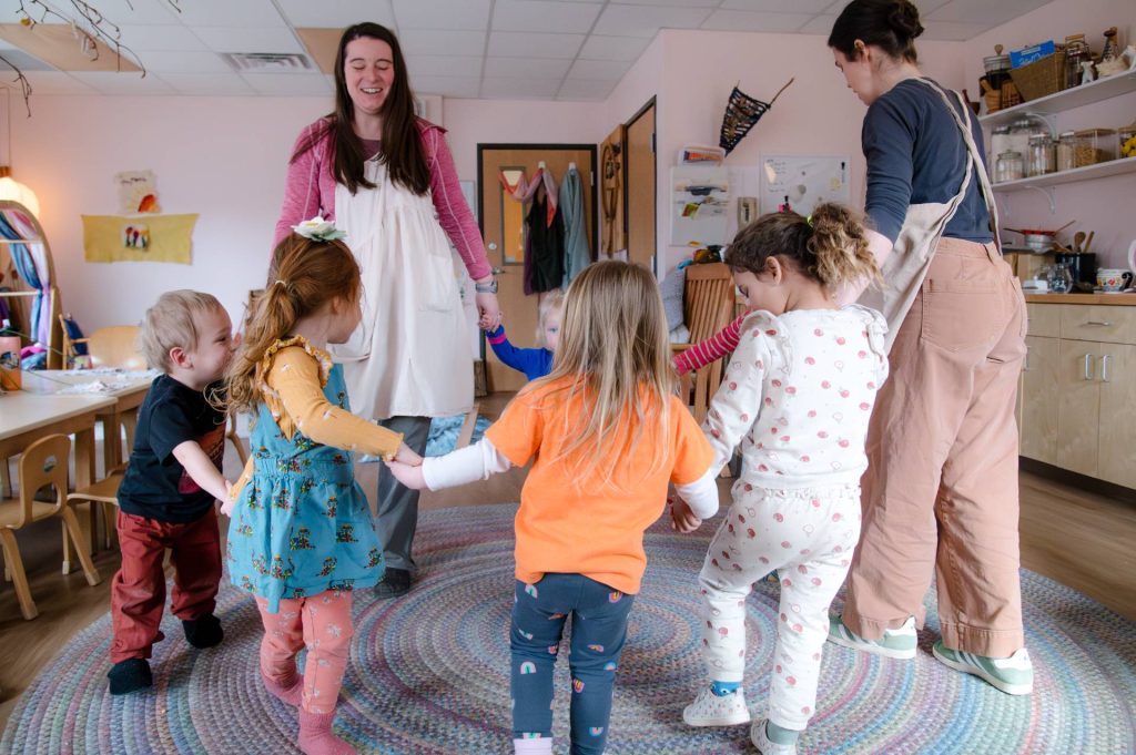 tulip poplar early childhood class children playing running in a circle