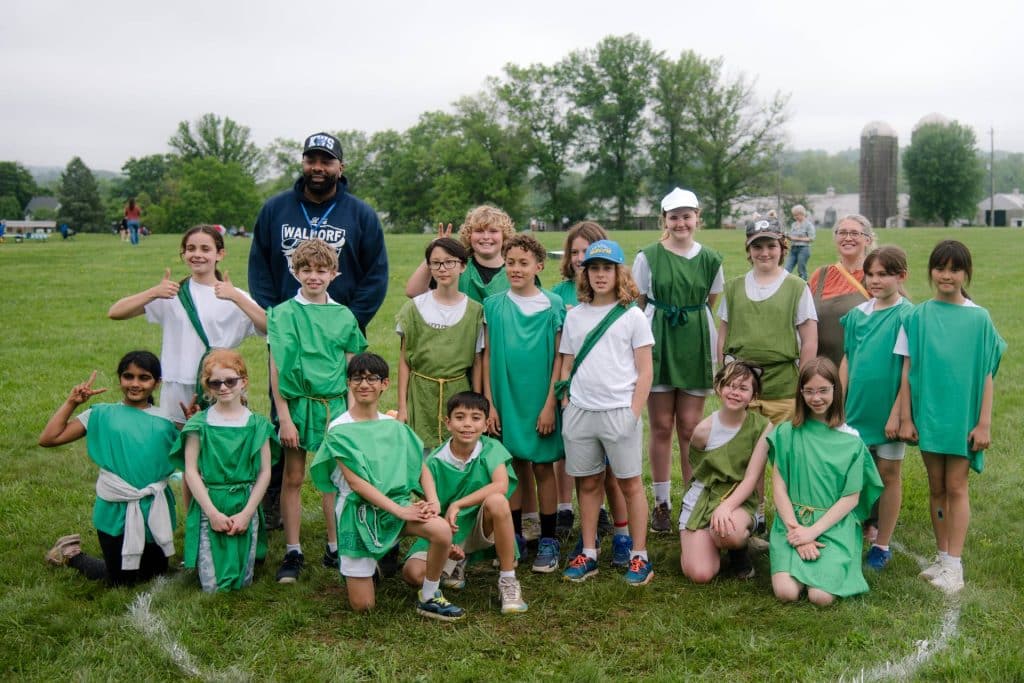 group of students at annual pentathlon dressed in green clothes