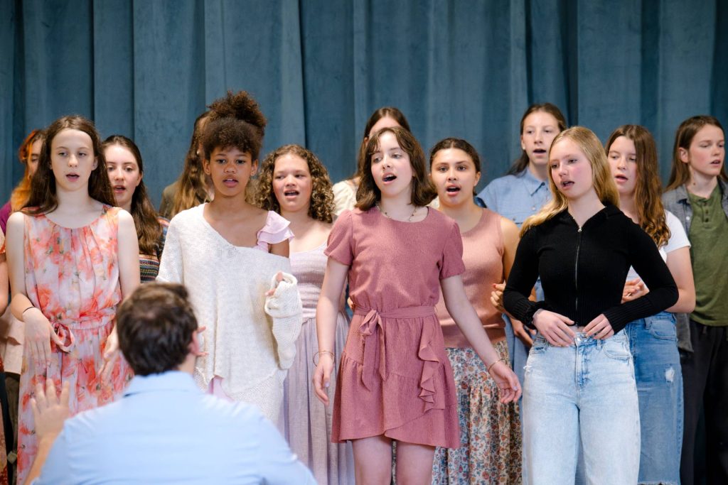 group of children singing at river valley waldorf event