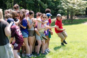 group of middle schoolers playing outdoors on field day