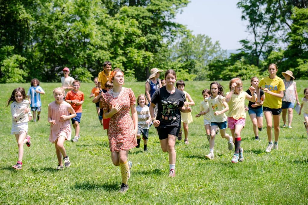 groups of students running across an open field