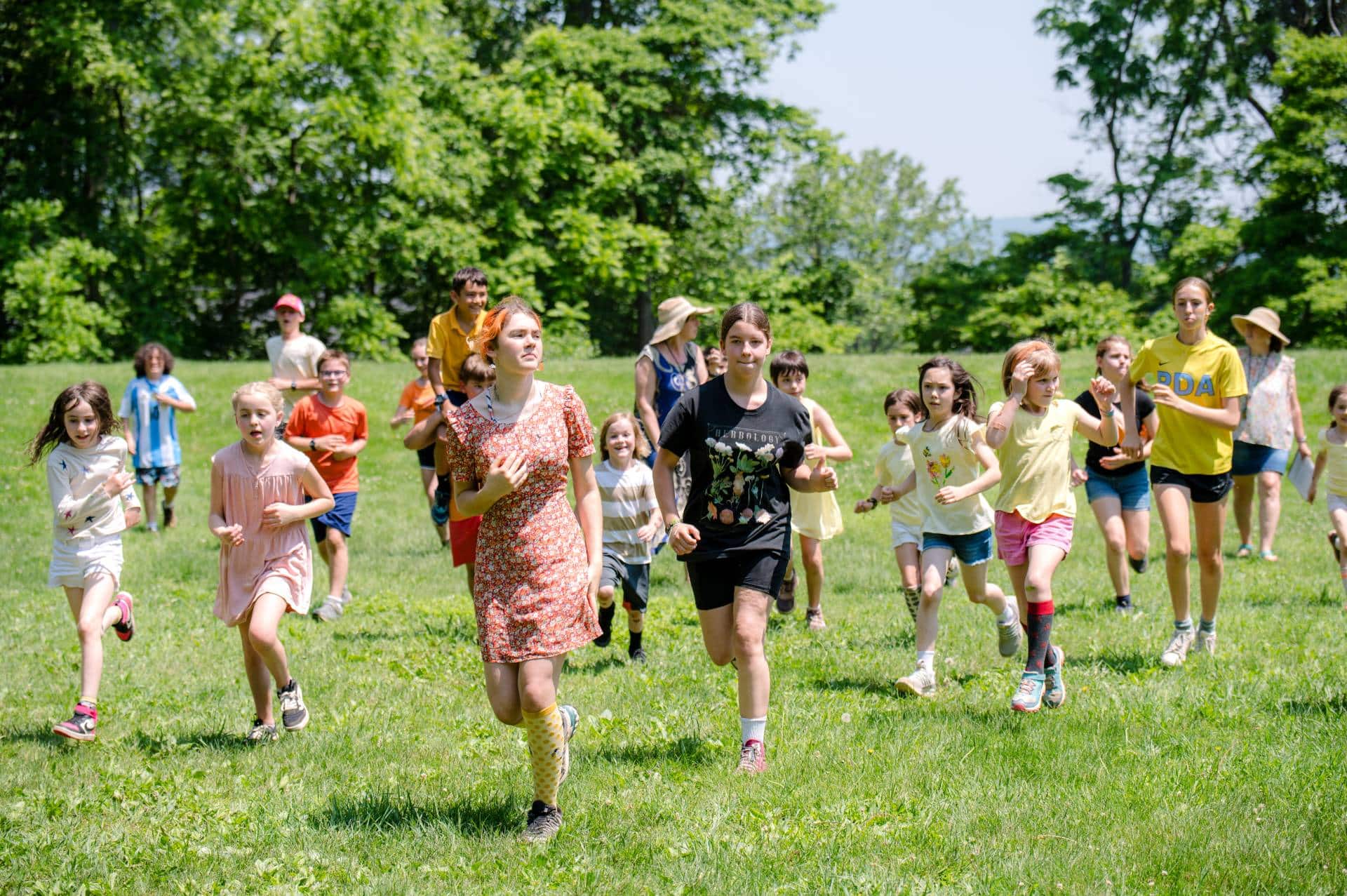 groups of students running across an open field