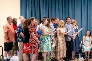 group of river valley teachers on stage at graduation