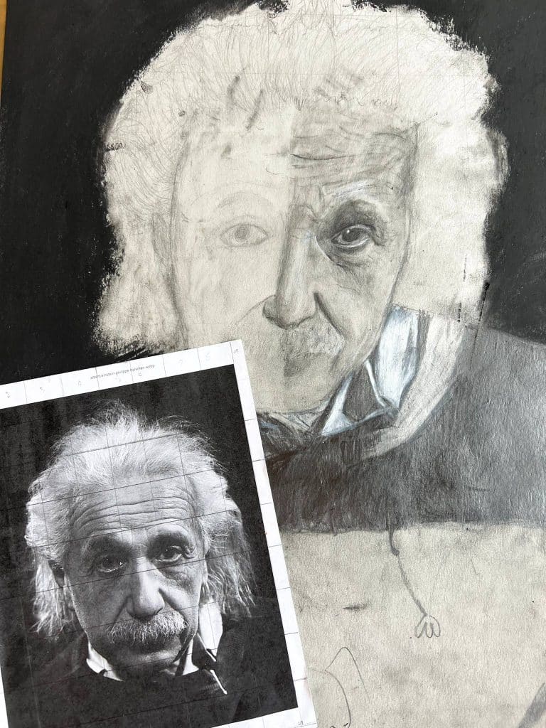 a pencil drawing of albert einstein by a river valley student