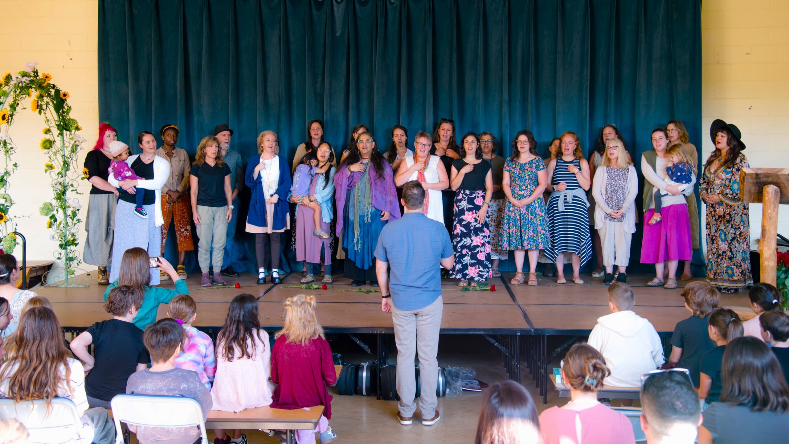 faculty of river valley waldorf school on a stage
