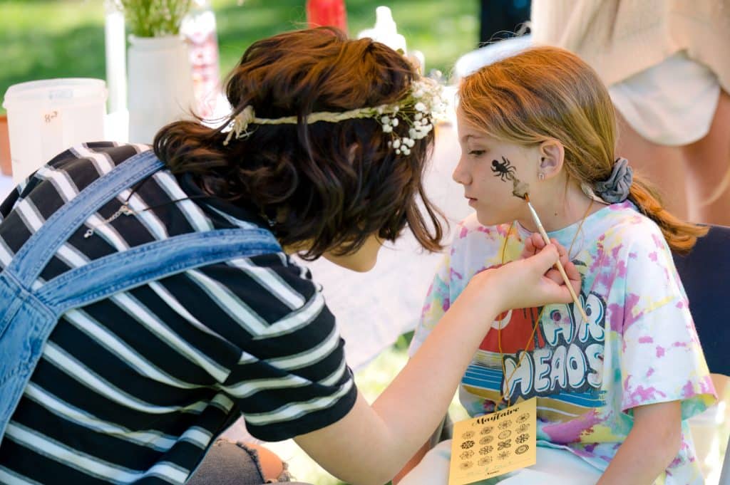 girls doing face painting