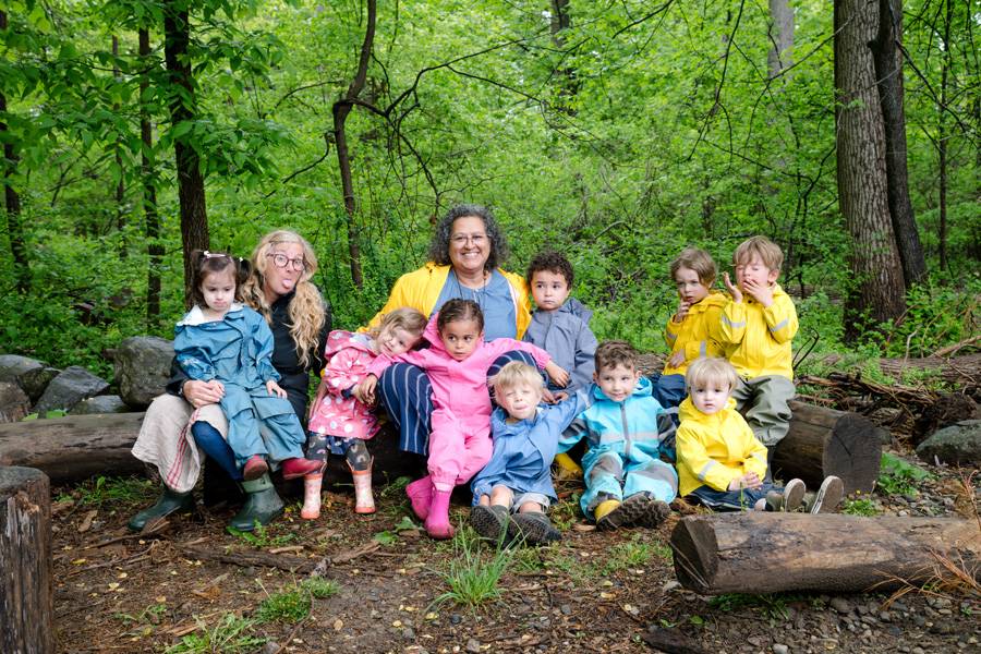 group of sundrop early childhood students with teacher outside for a group photo