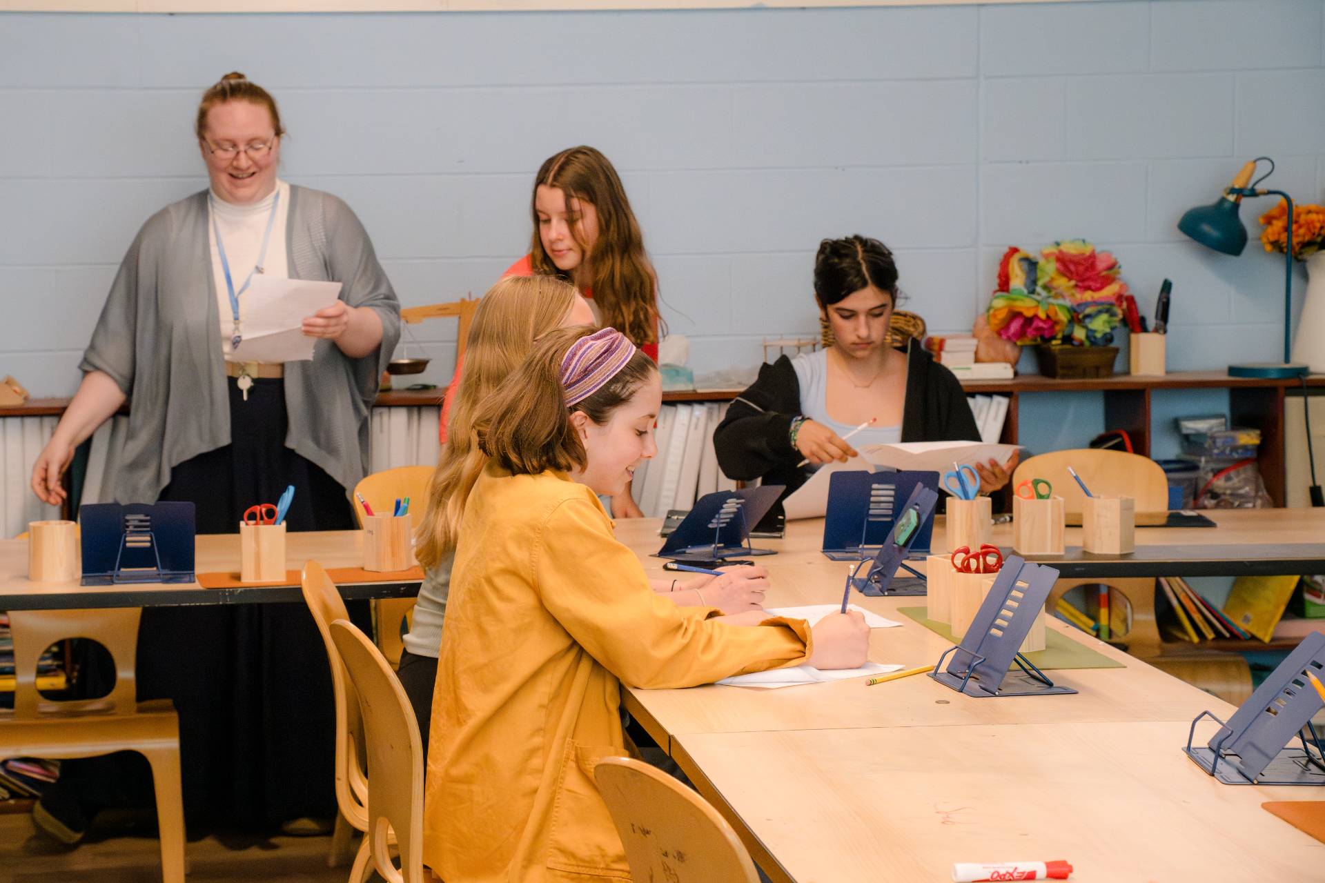 grades school children sitting at a table