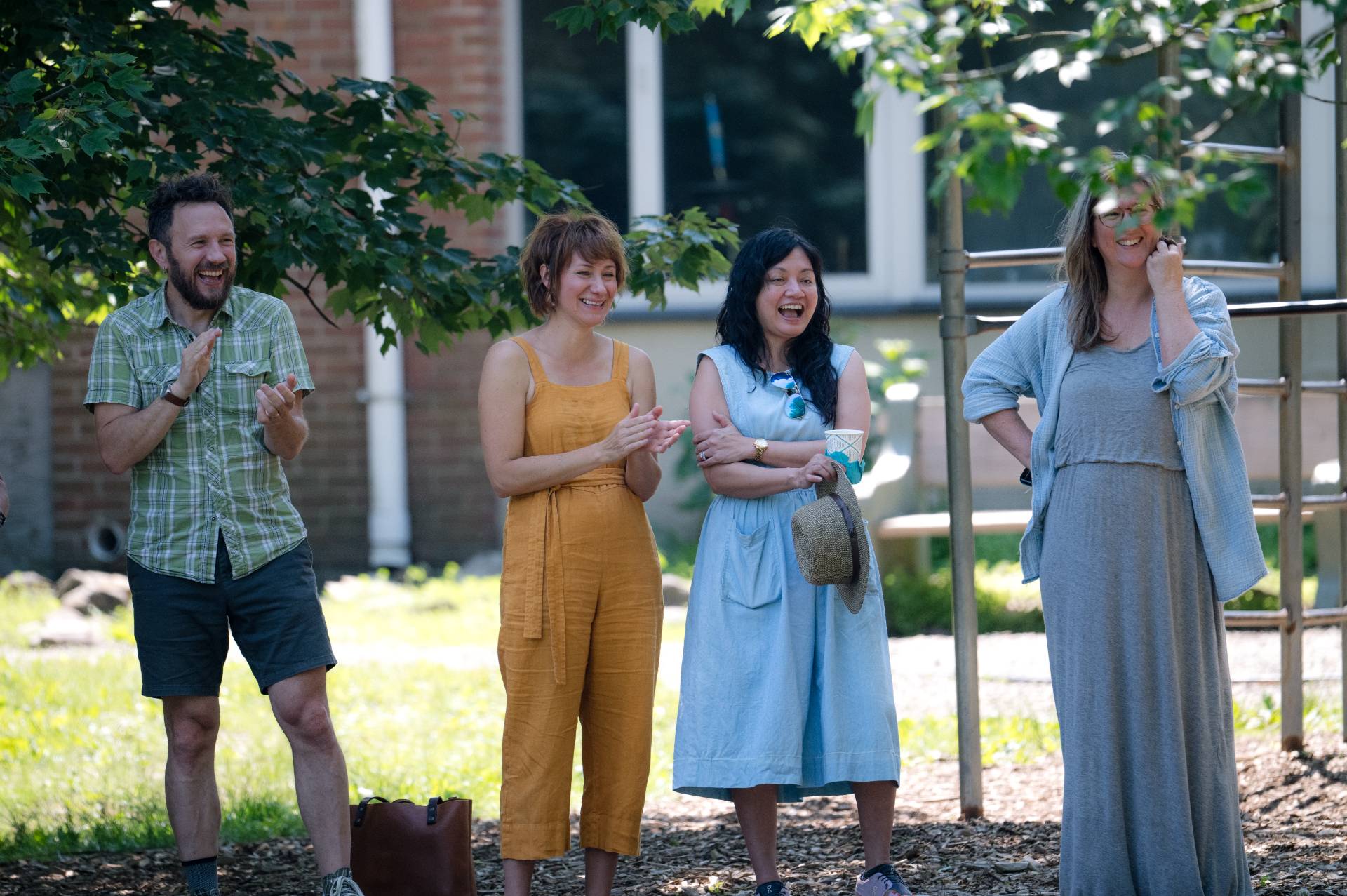 group of 4 river valley waldorf teachers on a stage
