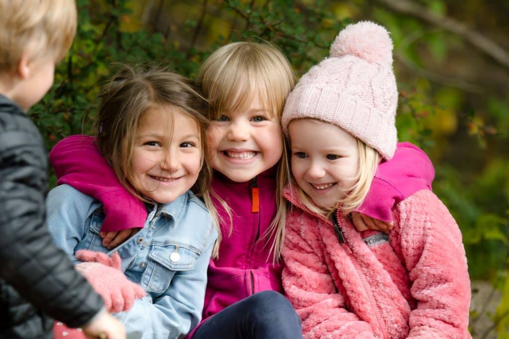 5 early childhood students outside in winter jackets
