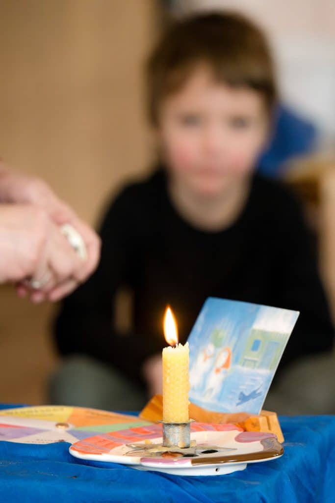 group of early childhood students smiling sitting on the floor