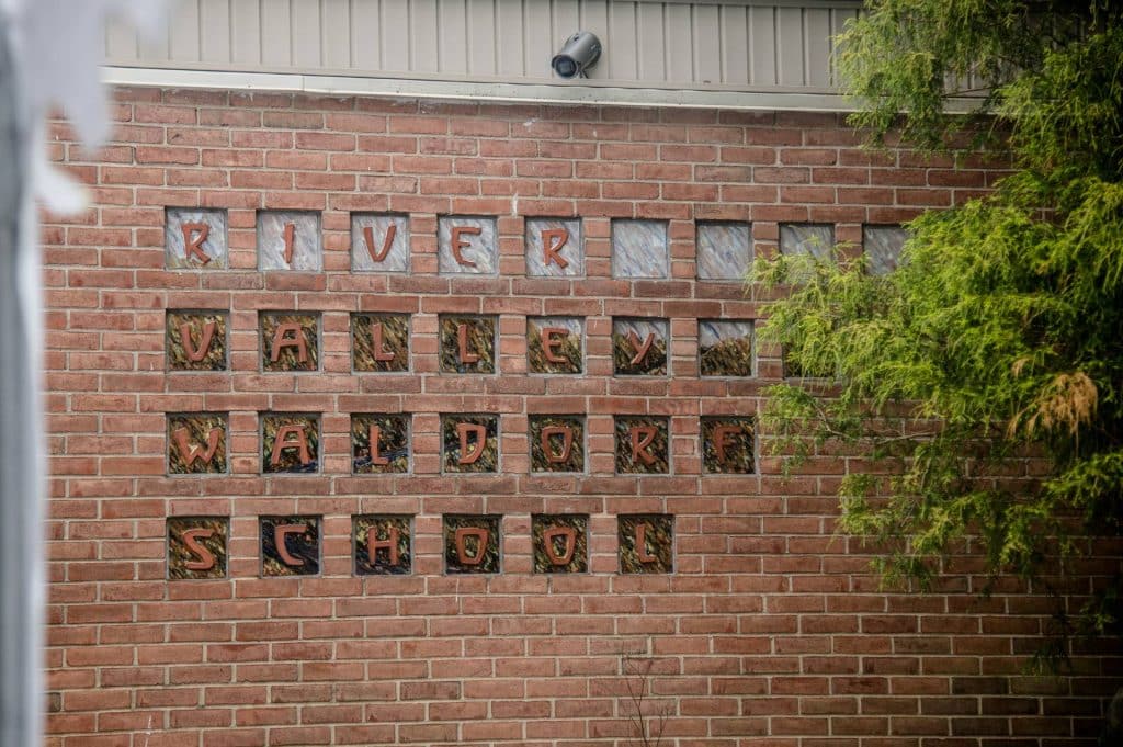brick wall that says river valley waldorf school