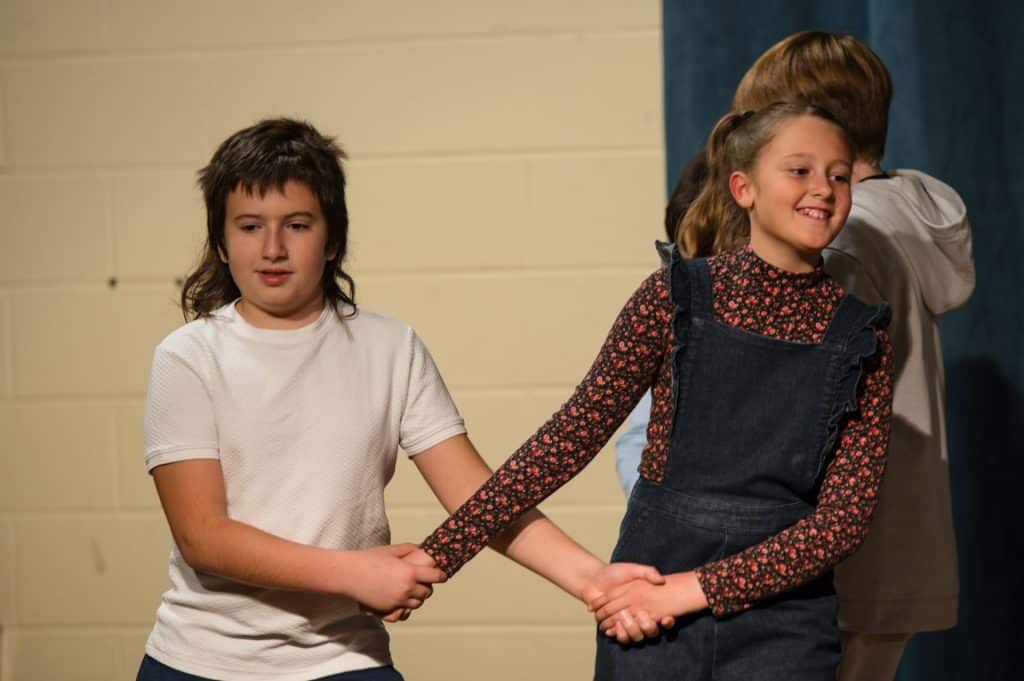 5 early childhood students outside in winter jackets